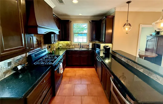 a kitchen with granite countertop lots of counter top space
