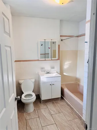 a bathroom with a bathtub and a sink