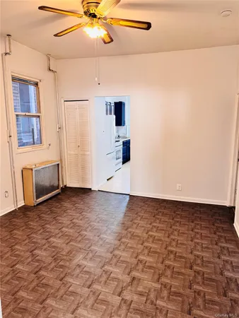 a kitchen with stainless steel appliances a stove a refrigerator and a sink with wooden cabinets