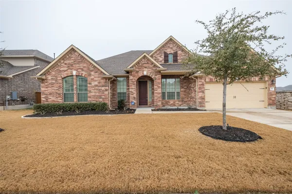 a front view of a house with yard
