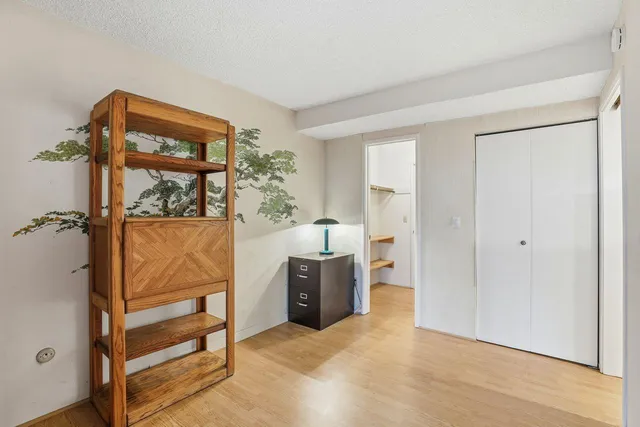 a view of an empty room and a window