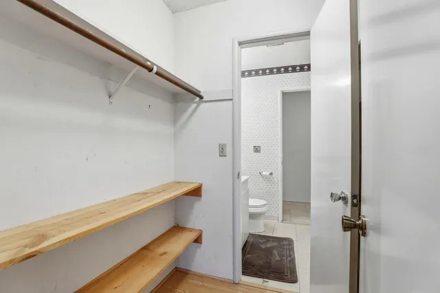 a bathroom with a window and a shower
