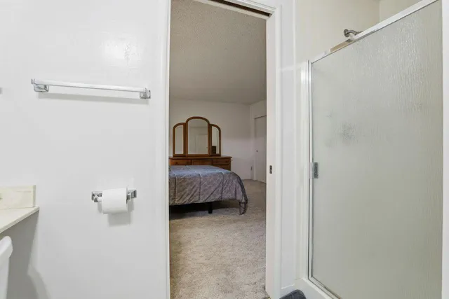 a en suite bathroom with a sink and mirror