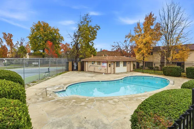 a view of a swimming pool with a patio