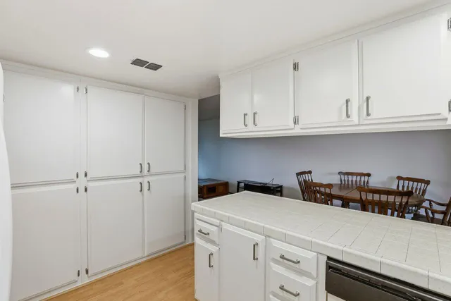 a view of cabinets and wooden floor
