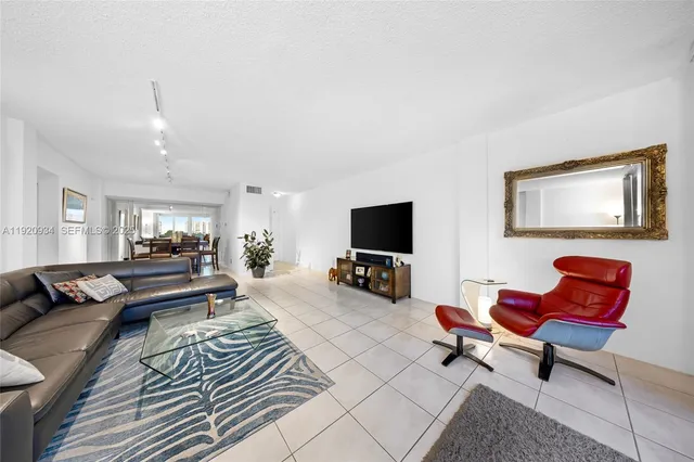 a kitchen with a stove and white cabinets