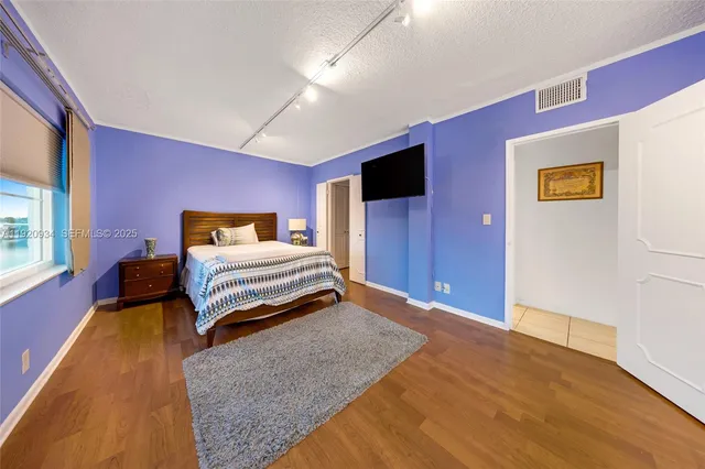 an aerial view of a house with a lake view