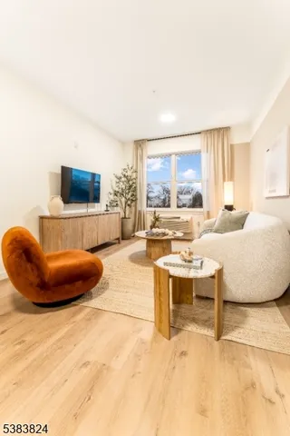 a living room with a couch and a flat screen tv