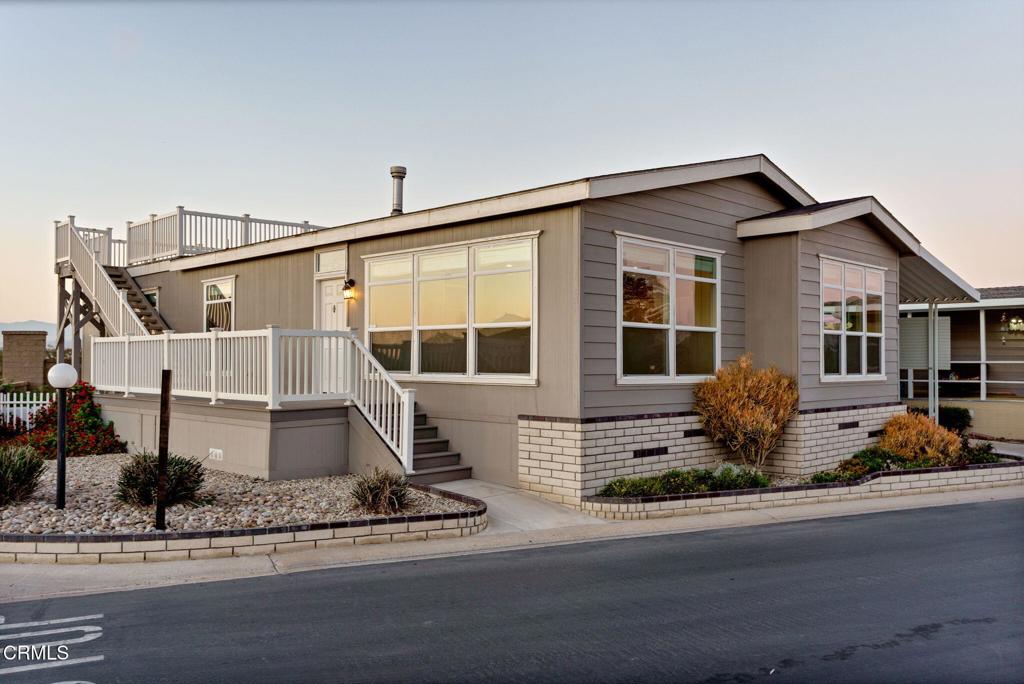 a front view of a house with entertaining space