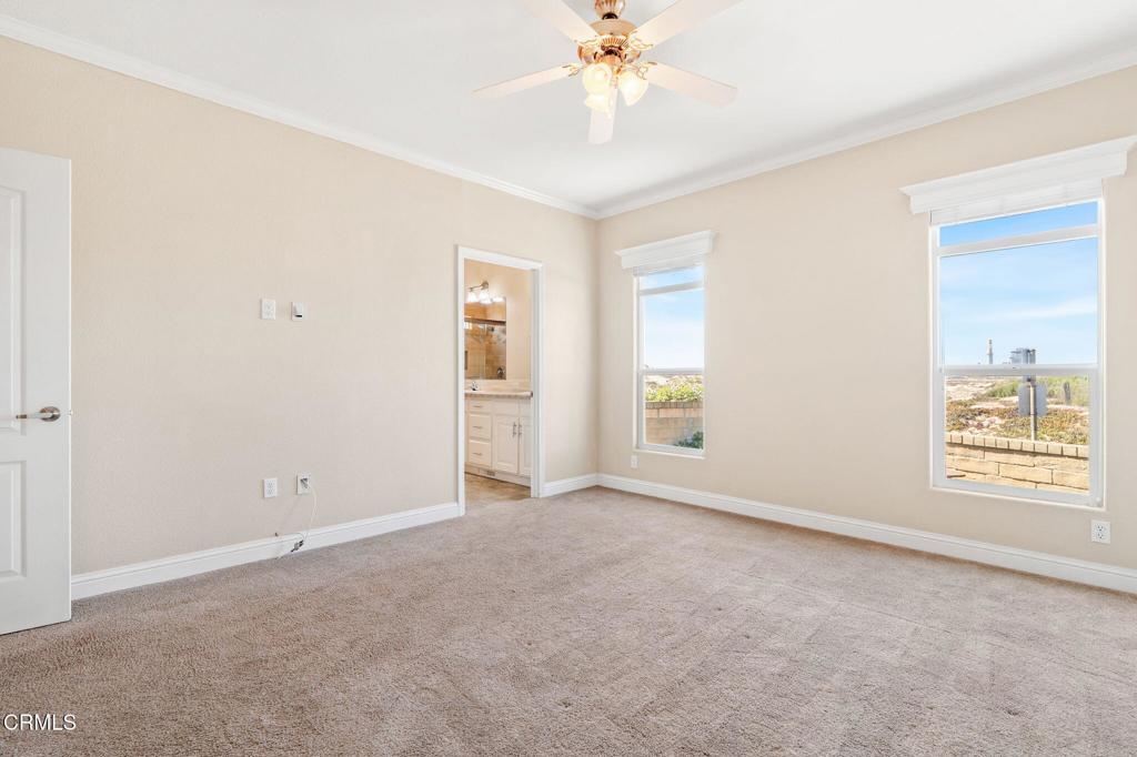5540 West 5th Street, Unit 1 Oxnard, CA 93035 - Photo 20 of 35 an empty room with windows and fan
