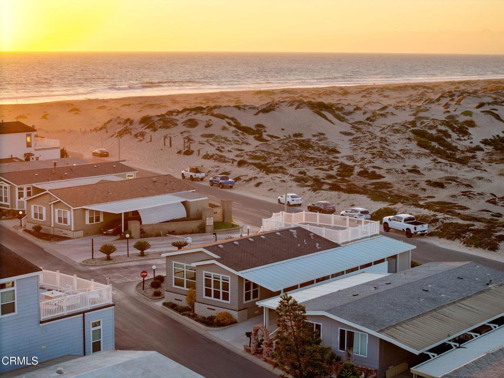 5540 West 5th Street, Unit 1 Oxnard, CA 93035 - Photo 2 of 35 an aerial view of residential houses with outdoor space