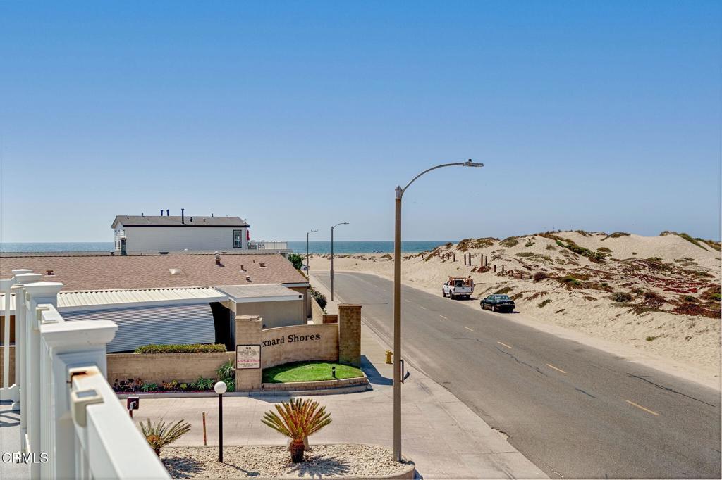 5540 West 5th Street, Unit 1 Oxnard, CA 93035 - Photo 23 of 35 a bed sitting in a bedroom next to a larger window