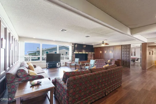a dining room with kitchen view and living room view