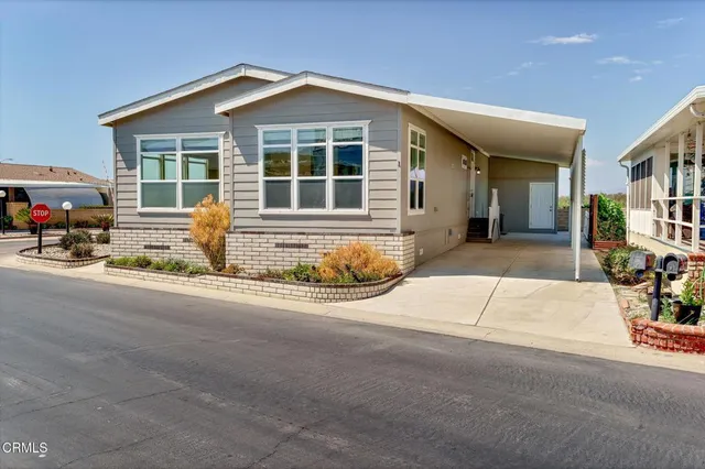 a front view of a house with a outdoor space