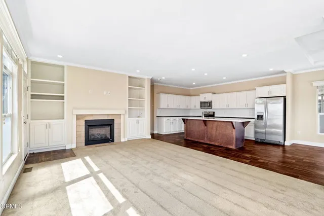 a view of kitchen with sink and wooden floor