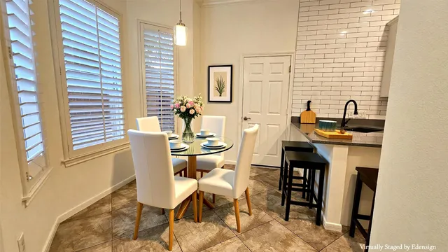 a dining room with furniture and window