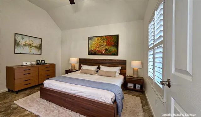 a bedroom with bed and window