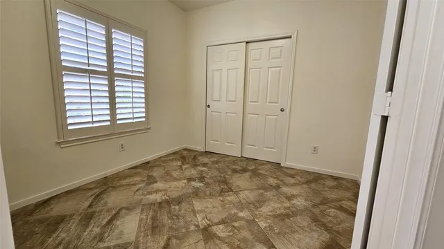 a view of an empty room and window