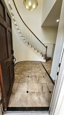 a backyard of a house with outdoor seating