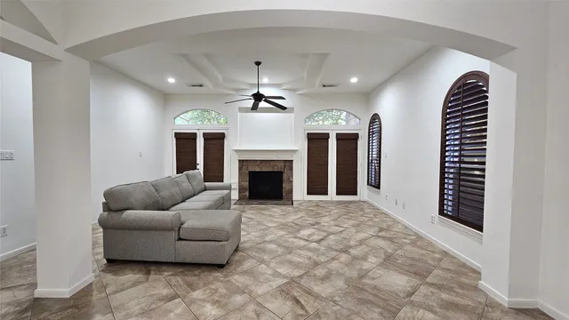 a living room with furniture and a fireplace