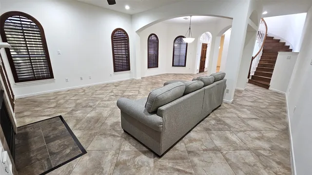 a living room with couches and furniture