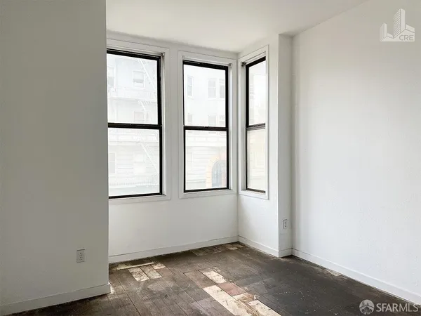 an empty room with windows
