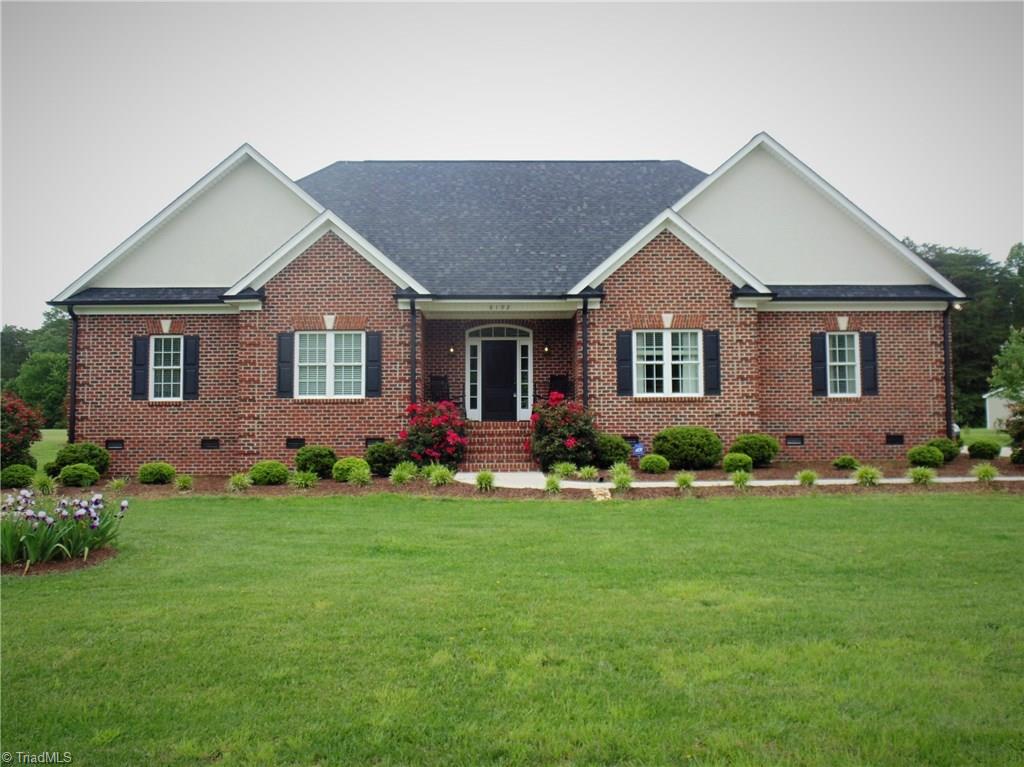 8192 Rylan Drive Browns Summit, NC 27214 - Photo 1 of 21 Curb appeal and more welcome you home! With symmetry and a lovely manicured lawn, this house beckons you in.
