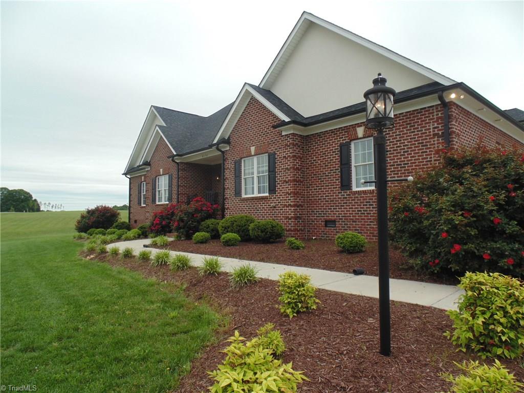 8192 Rylan Drive Browns Summit, NC 27214 - Photo 2 of 21 All brick home nestled on close to an acre with gracious space for all of your needs!