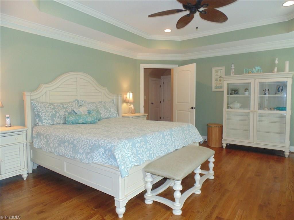 8192 Rylan Drive Browns Summit, NC 27214 - Photo 11 of 21 In the gracious master suite, you will find hardwood floors, gorgeous trim, and a wonderful master bath!