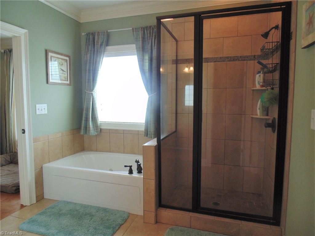 8192 Rylan Drive Browns Summit, NC 27214 - Photo 13 of 21 Whether you're feeling functional or luxurious, this bathroom has you covered!
