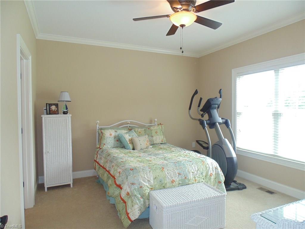 8192 Rylan Drive Browns Summit, NC 27214 - Photo 15 of 21 The third bedroom shares a bath with the second bedroom and is opposite the master suite.