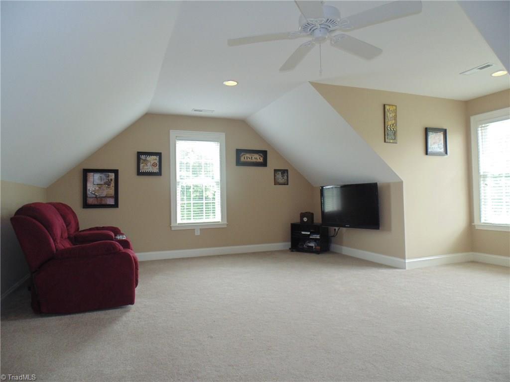 8192 Rylan Drive Browns Summit, NC 27214 - Photo 17 of 21 The fourth bedroom is located upstairs making it perfect for a teen suite or guest bedroom! There is a private bath and access to the walk-in attic!