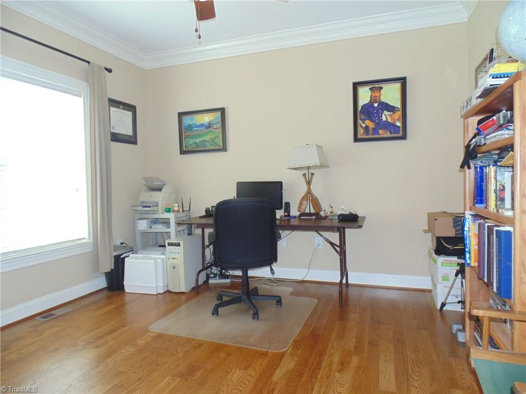 8192 Rylan Drive Browns Summit, NC 27214 - Photo 18 of 21 This room can be used as a home office or living room!