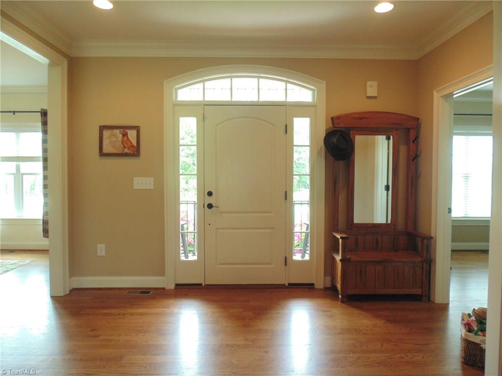 8192 Rylan Drive Browns Summit, NC 27214 - Photo 4 of 21 The foyer has ample space for welcoming guests or your daily routine!