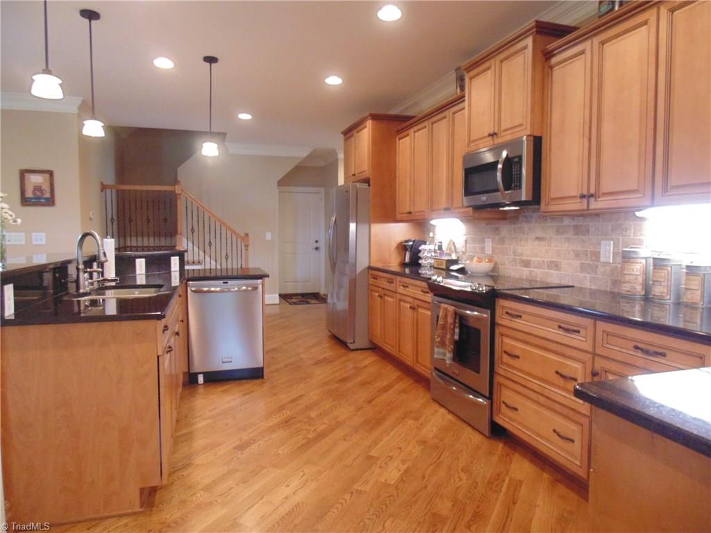 8192 Rylan Drive Browns Summit, NC 27214 - Photo 8 of 21 The kitchen overlooks the living room and offers stainless steel appliances!