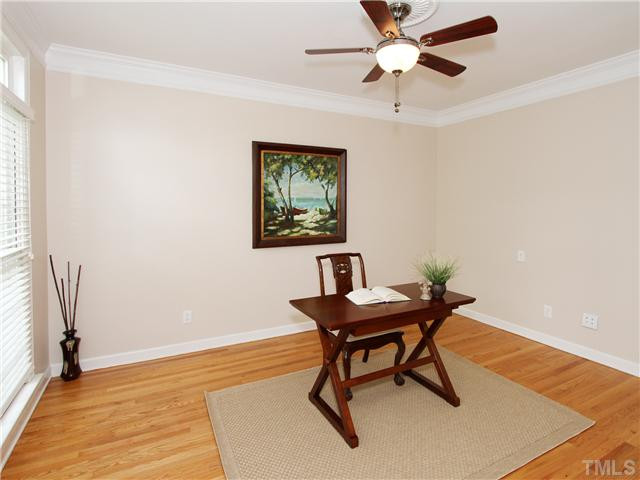 12409 Canolder Street Raleigh, NC 27614 - Photo 3 of 24 Formal Living Room with Crown Molding and Hardwood Floors Living Room