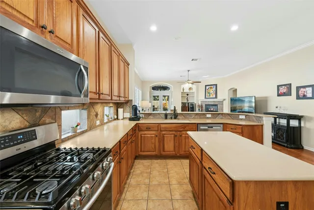 a kitchen with stainless steel appliances a sink and a stove