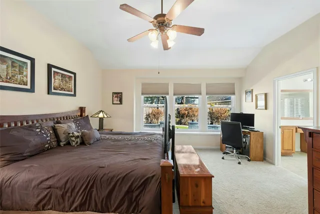 a bed room with a bed and a chandelier