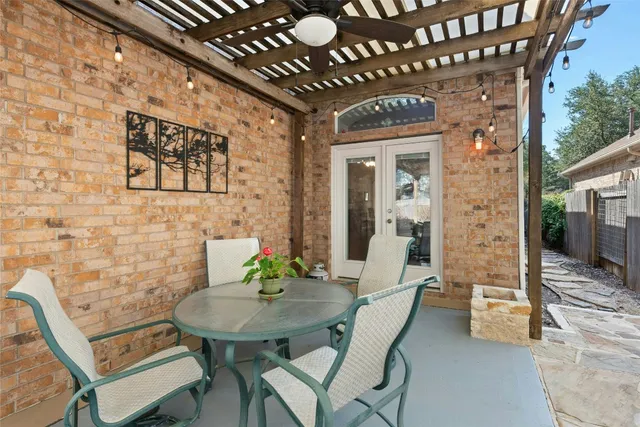 a view of a chairs and table in a patio