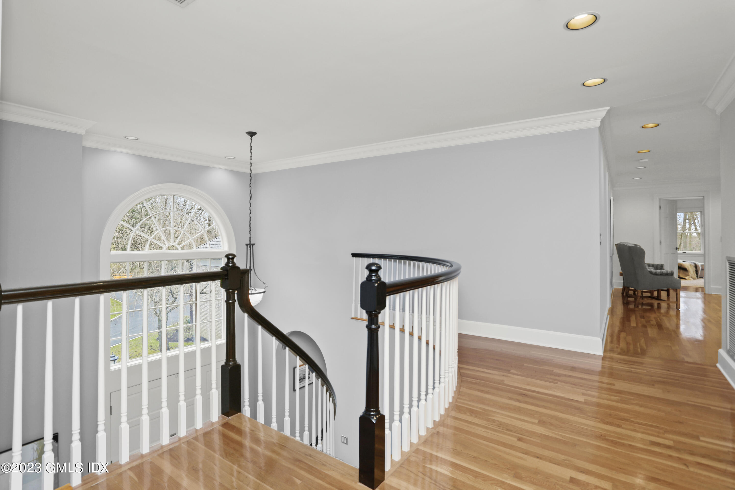 12 Juniper Hill Road Greenwich, CT 06830 - Photo 24 of 61 a view of a hallway with wooden floor and staircase