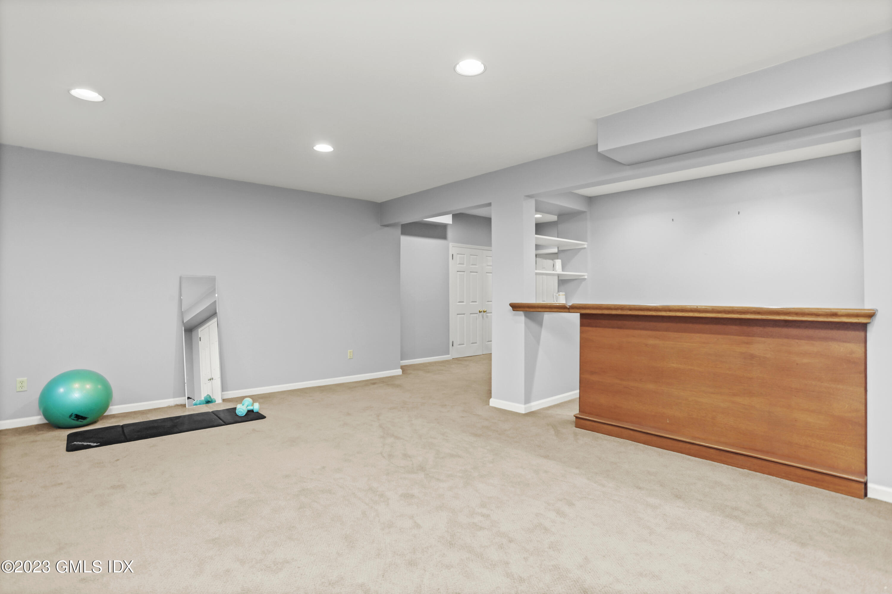 12 Juniper Hill Road Greenwich, CT 06830 - Photo 44 of 61 a view of an empty room with wooden floor