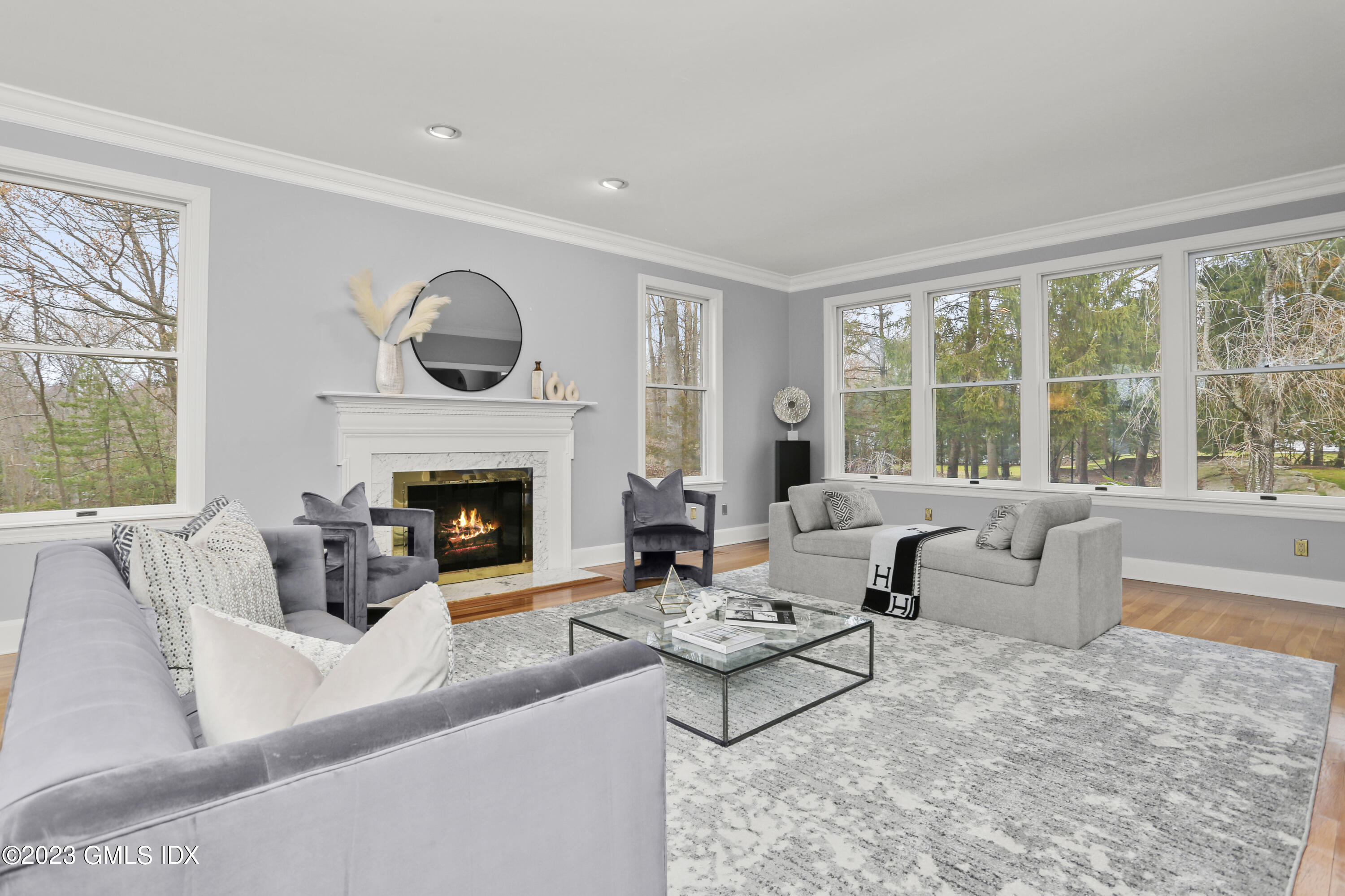 12 Juniper Hill Road Greenwich, CT 06830 - Photo 7 of 61 a living room with furniture and a fireplace