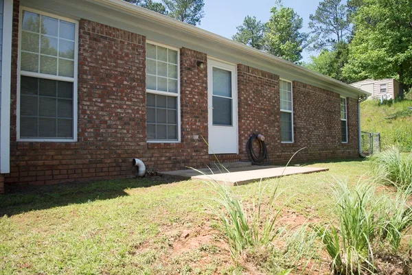 a view of house with yard