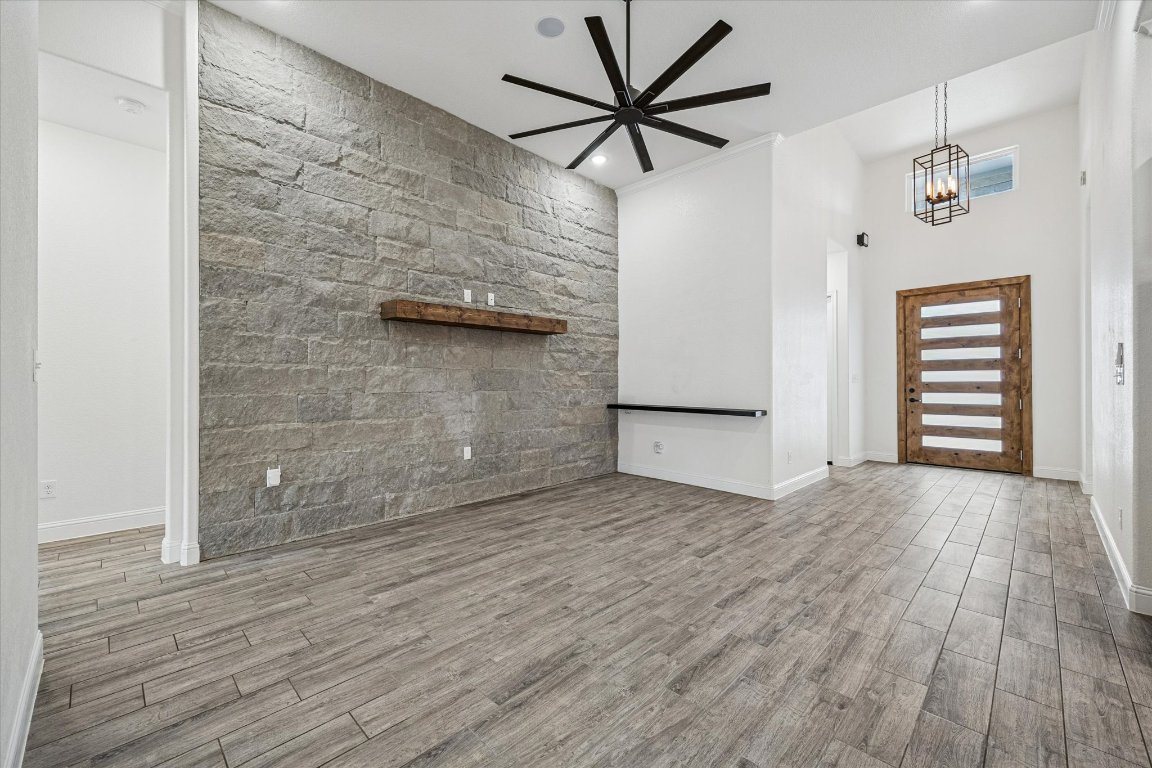136 Greg Lane Jarrell, TX 76537 - Photo 2 of 10 wooden floor in an empty room with a window