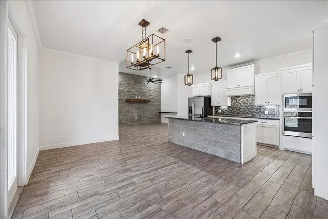 a view of a porch with furniture and garden