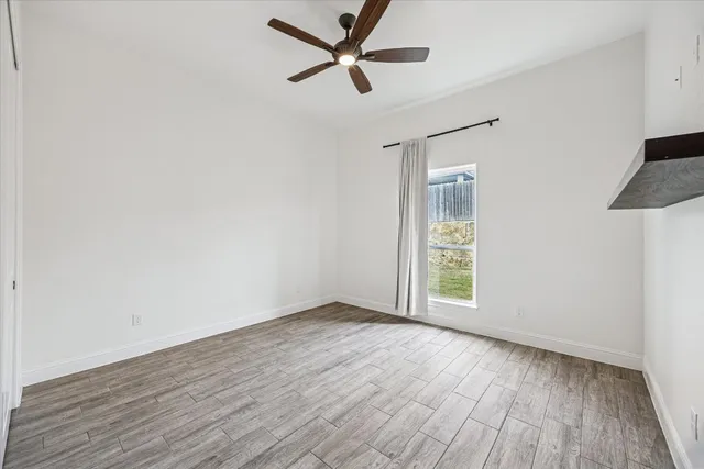 a bathroom with a granite countertop bathtub sink vanity and mirror