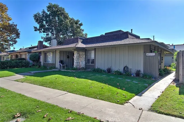 a view of a yard in front view of a house