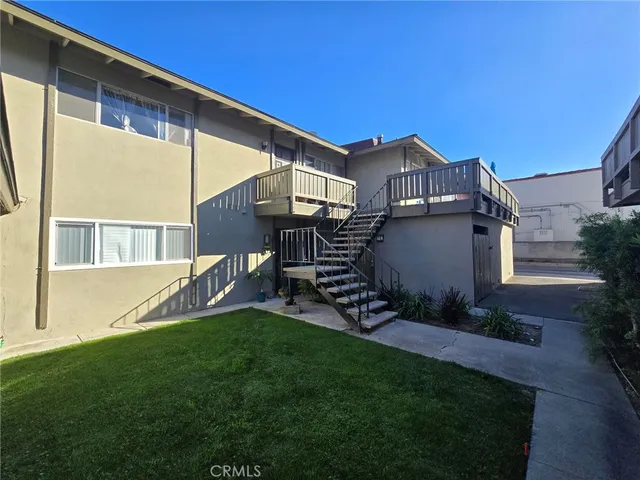 a view of house with backyard