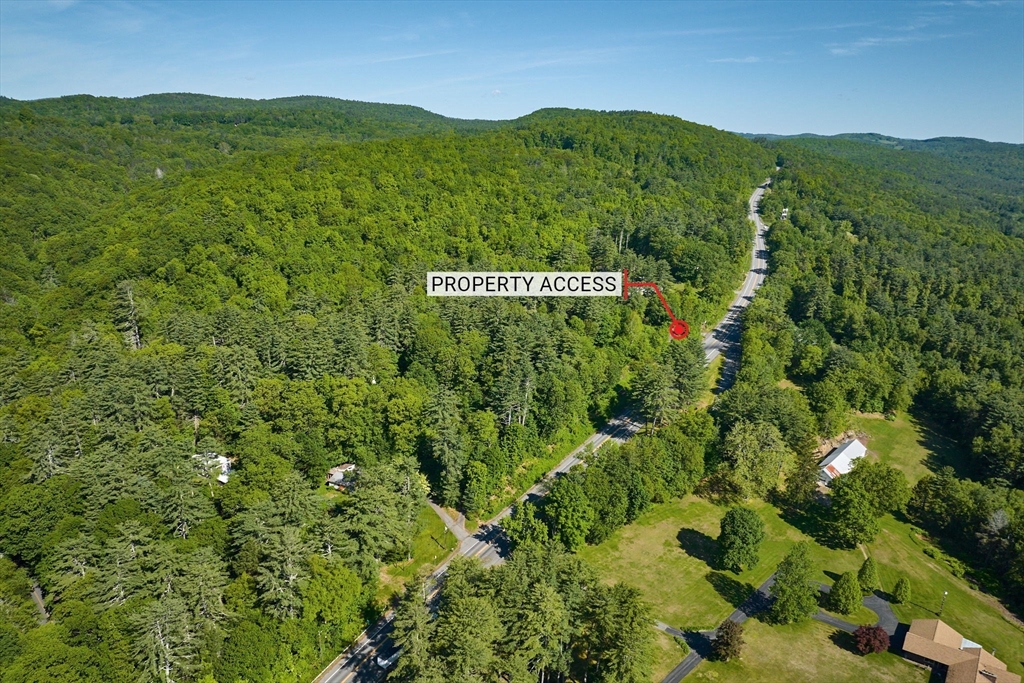 414 Mohawk Trail Greenfield, MA 01301 - Photo 3 of 10 a view of a lush green field with mountains in the background