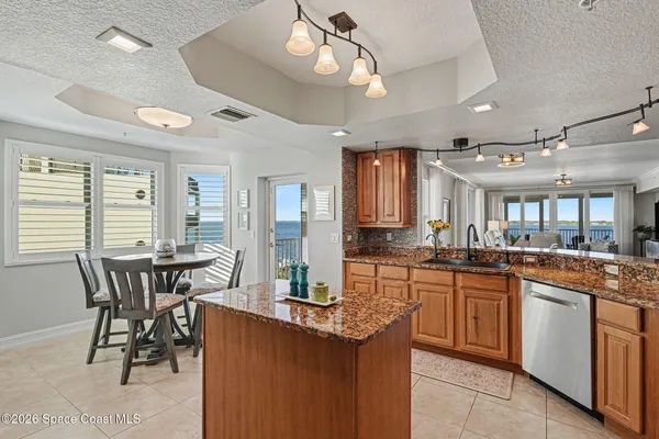 a living room with furniture and large windows